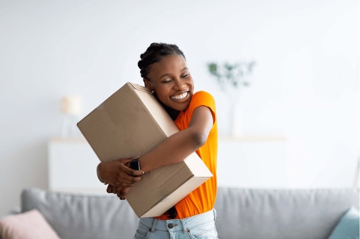 Person hugging a package after a good branded customer experience