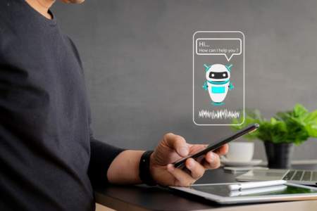 Person on cellphone interacting with a chatbot eCommerce marketing automation tool