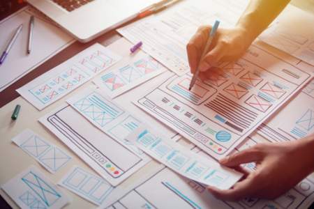 Person optimizing the wireframe designs for a user interface