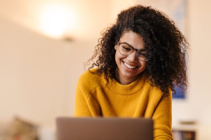 Smiling person researching ADA compliance for checkout processes