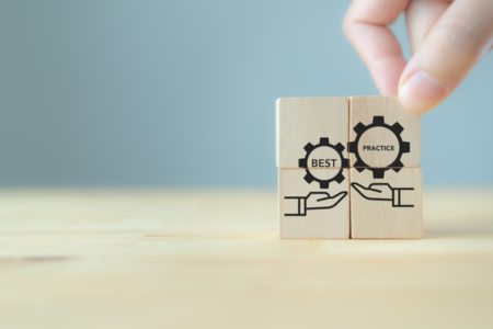 Engraved wooden blocks that say "Best Practice"