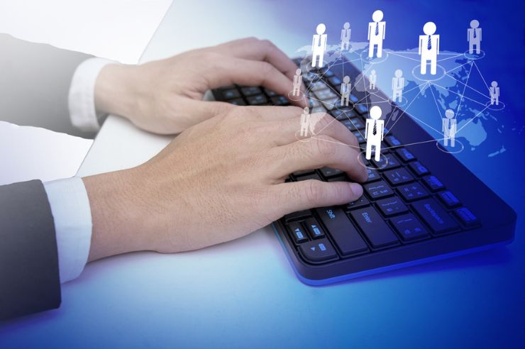 Hands typing on a keyboard