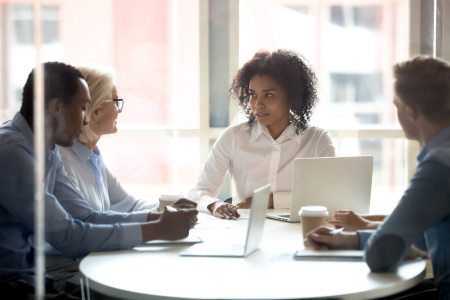 A group of lawyers discussing law firm marketing tactics for their marketing strategy.