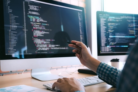 Web developer performing ongoing website maintenance to support ADA compliance