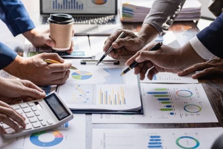 Marketers reviewing stats of campaign.