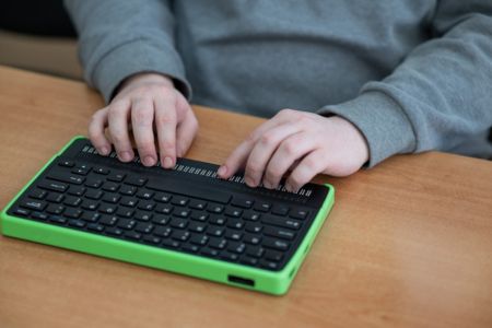Assistive technology keyboard being used.