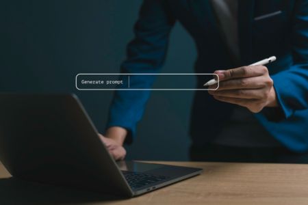 User with computer working with AI prompts.