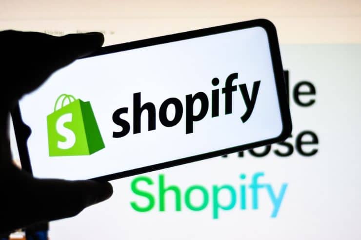 Shopify logo on a mobile phone.