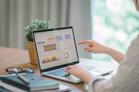 Woman reviewing campaigns' statistics.