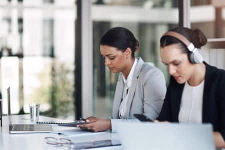 women working on legal documents.