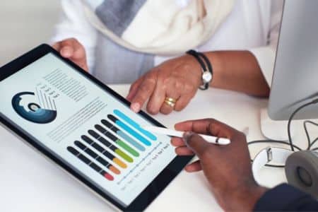 Businesspeople analyzing marketing data