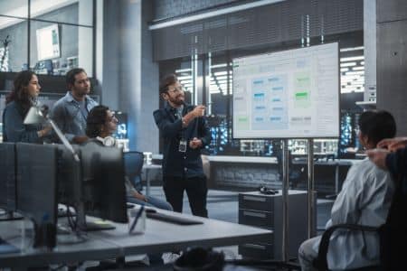 A team discussing an artificial intelligence project presentation