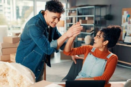 ecommerce team celebrating sales growth and success