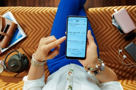 homeowner reading home services email on her phone
