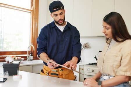 repair man providing home services to homeowner