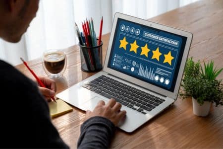 business owner reviewing customer ratings and online reputation.