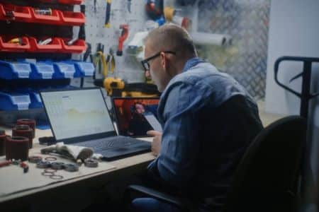 reviewing home service marketing performance on laptop