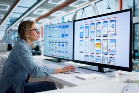ux designer reviewing website wireframes and user interface layouts